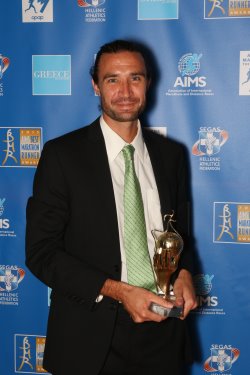AIMS Lifetime Achievement Award, presented to Frank Shorter and accepted by his son Alex Shorter